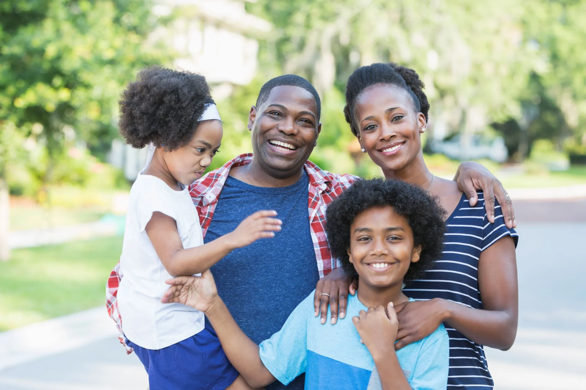 Happy family spending time together outdoors in a green park