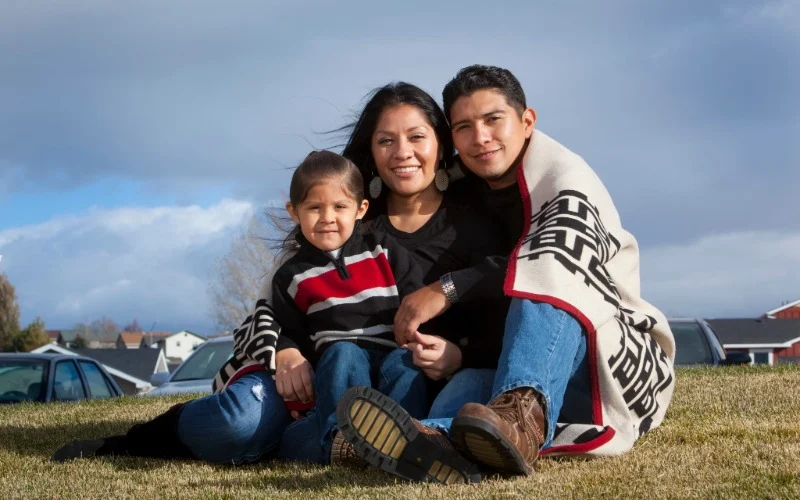 A family sitting outdoor