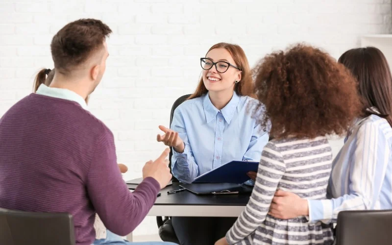 Social worker explains a process to a family